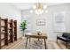 Contemporary home office featuring a stylish desk, modern lighting, and a comfortable seating area at 1343 Panini Dr, Henderson, NV 89052