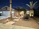Charming single story home with desert landscaping, stone walkway and cozy front porch with exterior lighting at 1367 Sun Pillars Ave, Henderson, NV 89014