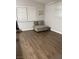 Bright living room with wood floors, large window, and comfortable seating area at 1367 Sun Pillars Ave, Henderson, NV 89014