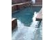Beautifully designed pool with raised edges and unique tiled steps for easy access at 1367 Sun Pillars Ave, Henderson, NV 89014