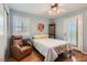 Comfortable bedroom featuring a lounger, a full sized bed, and modern décor at 1667 Sabatini Dr, Henderson, NV 89052