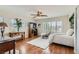 Stylized bedroom offering natural light, hard wood floors, decorative accents and a comfortable bed at 1667 Sabatini Dr, Henderson, NV 89052