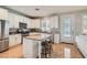 Well-appointed kitchen with granite countertops, stainless steel appliances, and a center island with seating at 1667 Sabatini Dr, Henderson, NV 89052