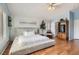 Spacious main bedroom with sleek bed, white bedding, shutters, and modern decor at 1667 Sabatini Dr, Henderson, NV 89052