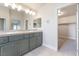 Bathroom featuring a double vanity and a closet for extra space and storage at 190 Tall Ruff Dr, Las Vegas, NV 89148
