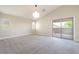 Bright bedroom with a sliding glass door providing access to a balcony at 190 Tall Ruff Dr, Las Vegas, NV 89148
