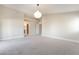 Neutral bedroom with archway to the bathroom and easy access to other rooms at 190 Tall Ruff Dr, Las Vegas, NV 89148