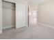 Bedroom featuring neutral decor and plush carpeting with an open closet with shelving at 190 Tall Ruff Dr, Las Vegas, NV 89148