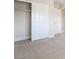 Bedroom featuring neutral decor and plush carpeting with an open closet with shelving at 190 Tall Ruff Dr, Las Vegas, NV 89148