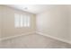 Bedroom featuring neutral paint, white baseboard trim, and plush carpeting with natural light at 190 Tall Ruff Dr, Las Vegas, NV 89148