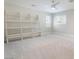 Bright bedroom with neutral decor, carpet flooring, window with shutters and built in shelves at 190 Tall Ruff Dr, Las Vegas, NV 89148