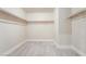 Walk in closet with shelving and space for storage of a large wardrobe at 190 Tall Ruff Dr, Las Vegas, NV 89148