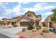 Two-story home featuring a two car garage, neutral color palette, and low maintenance landscaping at 190 Tall Ruff Dr, Las Vegas, NV 89148