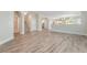 Open floor plan featuring contemporary neutral paint, arched doorways, and stunning wood flooring at 190 Tall Ruff Dr, Las Vegas, NV 89148