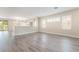 Open floor plan featuring contemporary neutral paint, arched doorways, and stunning wood flooring at 190 Tall Ruff Dr, Las Vegas, NV 89148