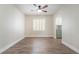 Open floor plan featuring contemporary neutral paint, arched doorways, and stunning wood flooring at 190 Tall Ruff Dr, Las Vegas, NV 89148