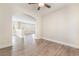 Open floor plan featuring contemporary neutral paint, arched doorways, and stunning wood flooring at 190 Tall Ruff Dr, Las Vegas, NV 89148