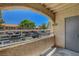 Relaxing balcony space overlooking a parking area, offering a private outdoor retreat at 201 Mission Laguna Ln # 104, Las Vegas, NV 89107