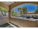Cozy balcony with views of the community and surrounding trees, perfect for enjoying the outdoors at 201 Mission Laguna Ln # 104, Las Vegas, NV 89107