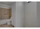 Modern bath featuring a tiled shower and a white cabinet at 201 Mission Laguna Ln # 104, Las Vegas, NV 89107