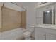 Bathroom featuring tiled shower, tub, and a modern vanity, creating a refreshing and functional space at 201 Mission Laguna Ln # 104, Las Vegas, NV 89107