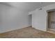 Bedroom with carpet, a closet and a door to another room at 201 Mission Laguna Ln # 104, Las Vegas, NV 89107