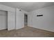 Bright bedroom with a closet, carpet, and a door to other room at 201 Mission Laguna Ln # 104, Las Vegas, NV 89107