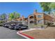 Inviting community exterior with assigned parking and well-kept grounds at 201 Mission Laguna Ln # 104, Las Vegas, NV 89107