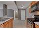 Spacious kitchen with stainless steel appliances and expansive tile flooring at 201 Mission Laguna Ln # 104, Las Vegas, NV 89107