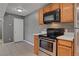 Cozy kitchen featuring stainless steel oven and microwave at 201 Mission Laguna Ln # 104, Las Vegas, NV 89107