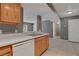 Bright kitchen with stainless steel sink, dishwasher, and tile flooring at 201 Mission Laguna Ln # 104, Las Vegas, NV 89107