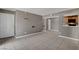 Spacious living room featuring tile flooring and access to the kitchen at 201 Mission Laguna Ln # 104, Las Vegas, NV 89107