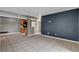 Open-concept living area with tile floors, view of the kitchen, and modern decor at 201 Mission Laguna Ln # 104, Las Vegas, NV 89107