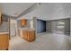 Open-concept living space with sliding glass door to balcony at 201 Mission Laguna Ln # 104, Las Vegas, NV 89107
