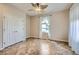 Bright bedroom featuring tile floors, a ceiling fan, natural light and a closet at 2148 Shadow Canyon Dr, Henderson, NV 89044