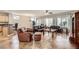 Expansive living area with tile flooring, comfortable leather seating, and a view into the kitchen at 2148 Shadow Canyon Dr, Henderson, NV 89044