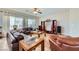 Open-concept living area featuring tile flooring, lots of natural light, and stylish furniture at 2148 Shadow Canyon Dr, Henderson, NV 89044