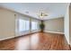 Open living room with hardwood floors, ceiling fan, and natural light at 2148 Shadow Canyon Dr, Henderson, NV 89044