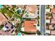 Aerial photograph shows an aesthetically pleasing neighborhood with terracotta roofs and green landscaping throughout the community at 2175 Sandstone Cliffs Dr, Henderson, NV 89044