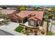 Beautiful home with terracotta roof, three-car garage, and drought-tolerant landscaping at 2175 Sandstone Cliffs Dr, Henderson, NV 89044