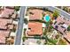 Detailed aerial shot of residences showcasing pools and meticulously landscaped yards in a Gathering-friendly neighborhood at 2175 Sandstone Cliffs Dr, Henderson, NV 89044