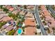 Aerial photography shows a residential neighborhood with terracotta roofs and well-manicured landscaping that adds character at 2175 Sandstone Cliffs Dr, Henderson, NV 89044