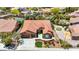 Expansive terracotta roof home with lush backyard featuring pool, pond, and putting green at 2175 Sandstone Cliffs Dr, Henderson, NV 89044
