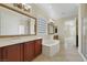 Luxurious bathroom with soaking tub, dual vanities, glass block window, and glass enclosed shower at 2175 Sandstone Cliffs Dr, Henderson, NV 89044