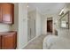 Luxurious bathroom with soaking tub, shower, dual vanities, and walk-in closet at 2175 Sandstone Cliffs Dr, Henderson, NV 89044