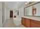 Luxurious bathroom with soaking tub, dual vanities, glass block window, and walk-in closet at 2175 Sandstone Cliffs Dr, Henderson, NV 89044