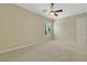 Clean bedroom with plantation shutters, carpeted floors, and a ceiling fan at 2175 Sandstone Cliffs Dr, Henderson, NV 89044