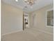 Bedroom with neutral carpet, crown molding, and doorway to another room at 2175 Sandstone Cliffs Dr, Henderson, NV 89044