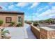 View of the home's front entrance with its elegant walkway and desert landscaping at 2175 Sandstone Cliffs Dr, Henderson, NV 89044