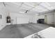 Neat and spacious garage featuring modern storage solutions and ample room for vehicles at 2175 Sandstone Cliffs Dr, Henderson, NV 89044